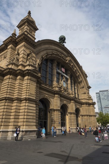 Frankfurt, Germany, September 1, 2015: Passengers outside the main building of the train station, Hauptbahnhof, in the city of Frankfurt in Germany, Europe