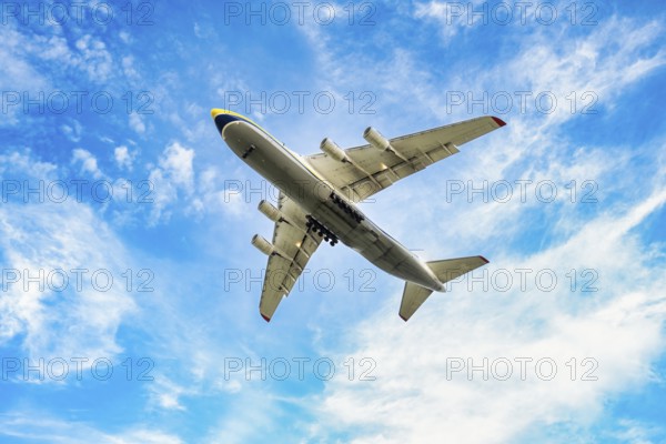 An airplane flying low on landing at Leipzig Airport