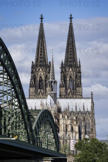 View of the east side of Cologne Cathedral from Deutz on the right bank of the Rhine along the Hohenzollern Bridge to the crossing tower and the imposing twin towers