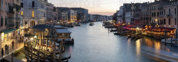 Evening light at sunset, view over the Grand Canal, gondola and boats, from the Rialto Bridge, panoramic shot, Venice, Veneto, Italy, Europe