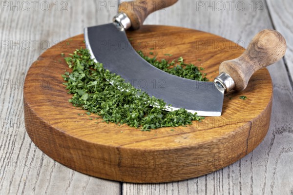 Parsley. On a chopping board in the kitchen