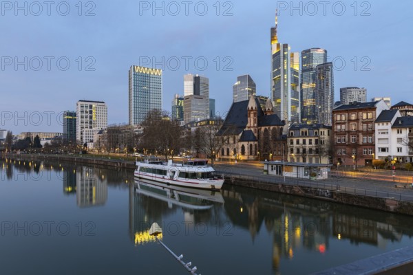 View over the Main to the skyline. Sunrise in the background. Taken in the morning in Frankfurt am Main
