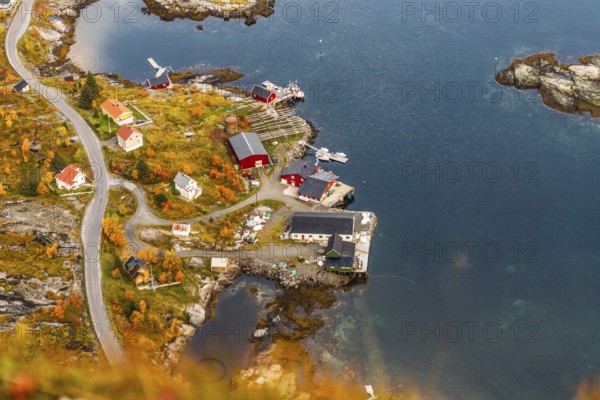 Aerial view of a small island village surrounded by a vibrant autumn landscape, mountains, rocks, road, sea, ocean, water, nature, couds, vilage, Lofoten Islands, Norway, Norge, Europe