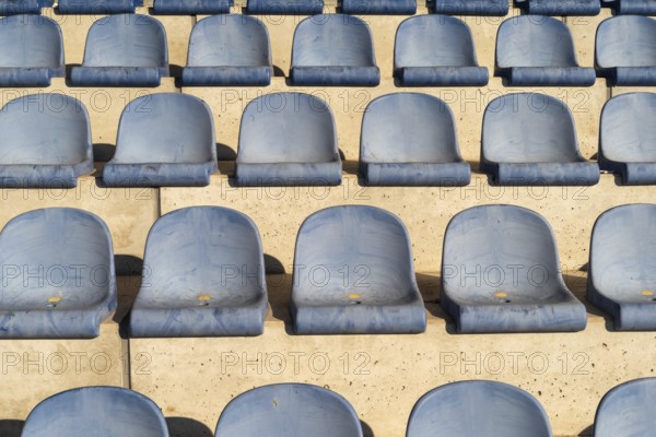 Rows with blue seat shells on a sports stand
