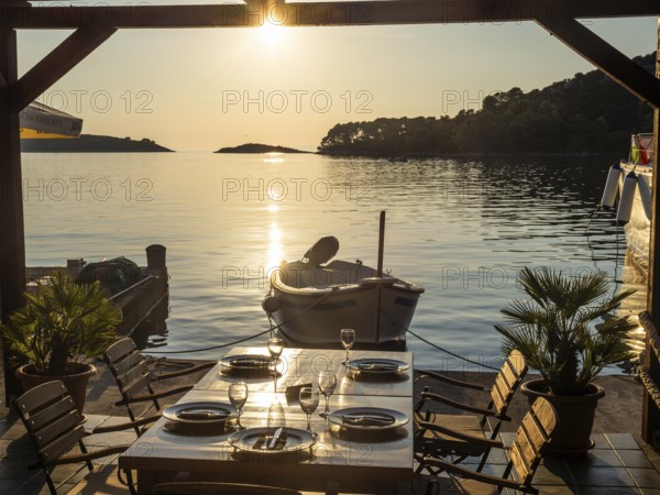 Set table of a restaurant, boat in the harbour of Pomena, island Mljet, Dubrovnik-Neretva, Dalmatia, Croatia, Europe