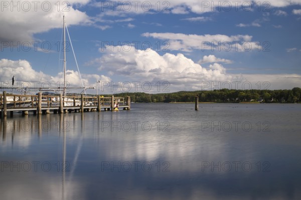 View over the Scharmützelsee with jetty and marina, long exposure, Wendisch-Rietz, Brandenburg, Germany, Europe