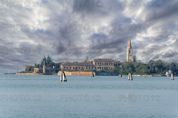 View from Lido to abandoned Poveglia Island, a former Psychiatric Hospital in Venice, Italy, Europe