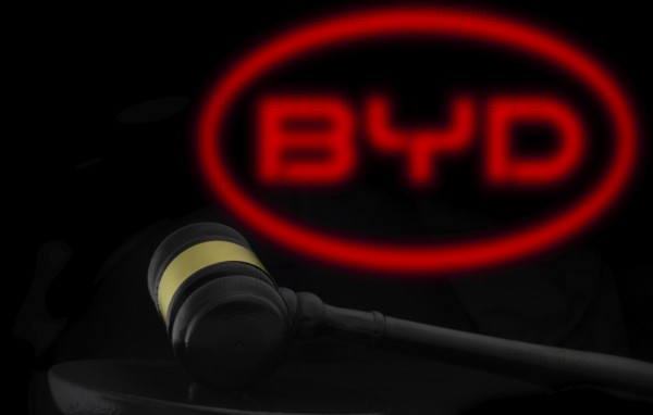 Court gavel in front of the BYD logo. BYD Auto Co Ltd is the main automotive subsidiary and brand of BYD Company.