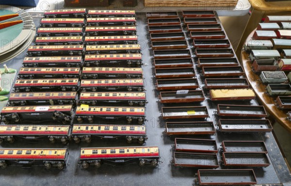 Model railway toy train set items on display for sale at auction room, UK