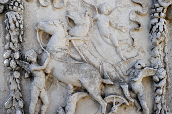 Relief on the sacred altar of Romulus and Remus, Sacello dell' Ara di Romolo e Remo, angel, chariot, stone carving, remains, ruins, ancient port city of Rome, excavation site Archaeological Park Ostia Antica, metropolitan city of Rome, Lazio, Italy, Europe