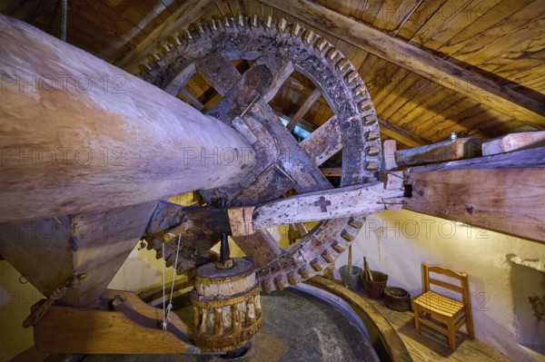 Interior view with wooden mill wheel in a rustic attic, Kefalos, Kos, Dodecanese, Greek Islands, Greece, Europe