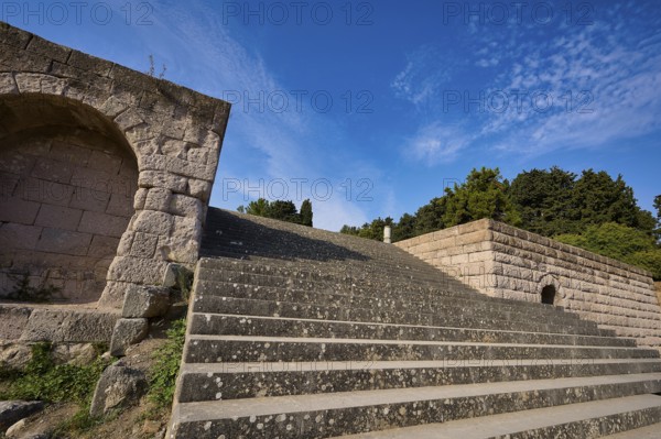 Stone staircase with ancient structures, surrounded by trees and clouds, open staircase to the second terrace, Asklipion, Asklepieion, healing temple, temple, Hippocrates, Kos, Dodecanese, Greek Islands, Greece, Europe