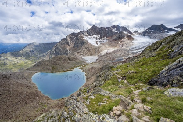Dramatic high mountain landscape, view of Vogelhüttensee mountain lake and Übeltalferner glacier, Stubai Alps, South Tyrol, Italy, Europe