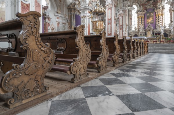 Artfully carved cheeks of the church pews in the collegiate basilica, Neustift St Margarethen, Vahrn, district of Bozen, South Tyrol, Italy, Europe