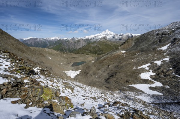 View at the Kesselkeessattel, mountain landscape with Kesselkeessee, snow-covered summit of the Großglockner in the background, Wiener Höhenweg, Schober group, Hohe Tauern National Park, Carinthia, Austria, Europe
