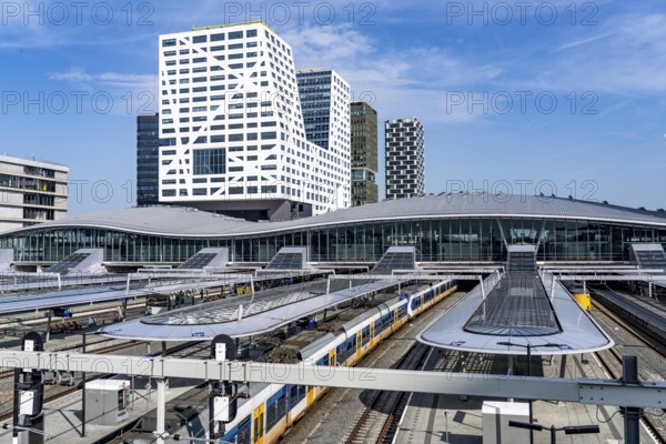 Utrecht Centraal railway station, tracks and concourse, trains of Nederlandse Spoorwegen N.V. state railway company, office building in the city centre, Netherlands