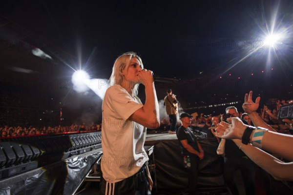 Emily Armstrong, lead singer of Linkin Park in the photo pit between the audience live on From Zero World Tour 2025 at the Olympiastadion Berlin on 18 June 2025