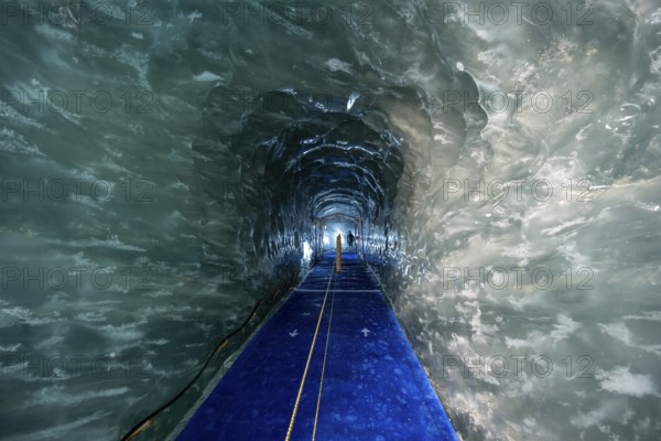 Artificial ice cave through the glacier ice, Mer de Glace, Montenvers, Chamonix, Haute-Savoie, France, Europe