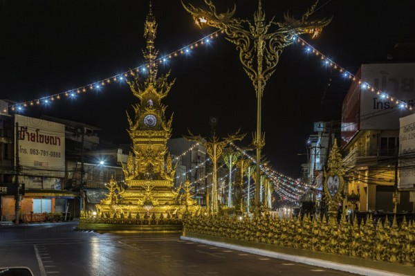 Clock Tower of Chiang Rai monument designed by local artist Chalermchai Kositpipat to honor the late Thai king