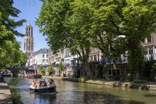 The old town centre of Utrecht, Oudegracht, around 2 km long with many old houses, cathedral tower, highest church tower in the Netherlands, newly renovated, shops, restaurants directly on the canal, many bridges, boat traffic of all kinds, canal tour, Netherlands