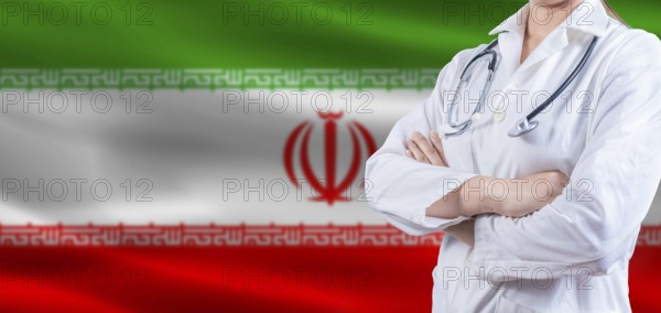 Doctor with crossed arms on Iran flag. Iran health and care concept. Female doctor on Iran flag