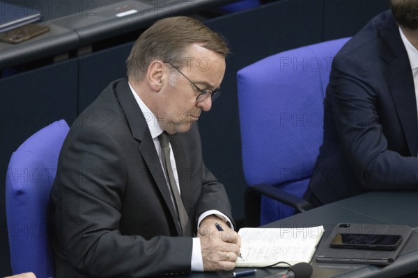Berlin, Germany - 24.6.2025: Defence Minister Boris Pistorius takes notes during the government statement by Federal Chancellor Friedrich Merz on the NATO summit and the European Council in the Bundestag in Berlin