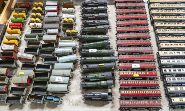Model railway toy train set items on display for sale at auction room, UK