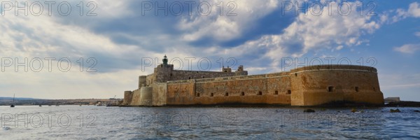 Castello Maniace, Maniace sea fortress, large Mediterranean fortress under a cloudy sky on the water, boat trip around the island of Ortigia, Isola di Ortigia, Syracuse, Sicily, Italy, Europe