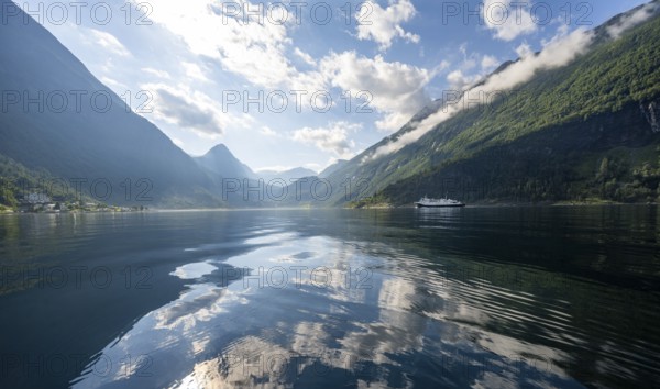 Atmospheric fjord landscape at Geirangerfjord with reflection, Møre og Romsdal, Norway, Europe