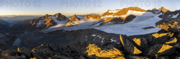 Picturesque high mountain landscape at sunrise with alpenglow, blue glacial lakes, glaciers and rocky mountain peaks in the morning light, view at Becher of mountain peaks Königshofspitz and Sonklarspitze and Schwarzwandspitz with glacier Übeltalferner, Stubai Alps, South Tyrol, Italy, Europe