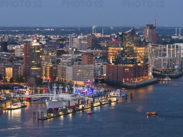 Aerial view of the Landungsbrücken in the harbour at blue hour with the Elbphilharmonie in the background, Hamburg, Germany, Europe