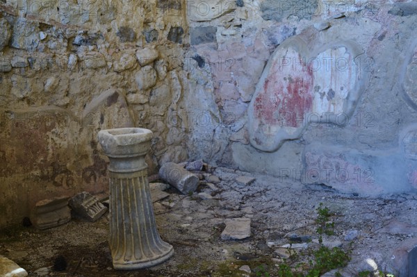 Ancient stone column and ruins in a ruined environment, Archaeological site, House of Europe, Western Excavation, Kos Town, Kos, Dodecanese, Greek Islands, Greece, Europe