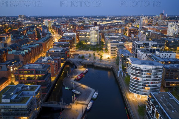 Aerial view of the Speicherstadt Hamburg with Magellan Terraces at Sandtor harbour at blue hour, Hamburg, Germany, Europe