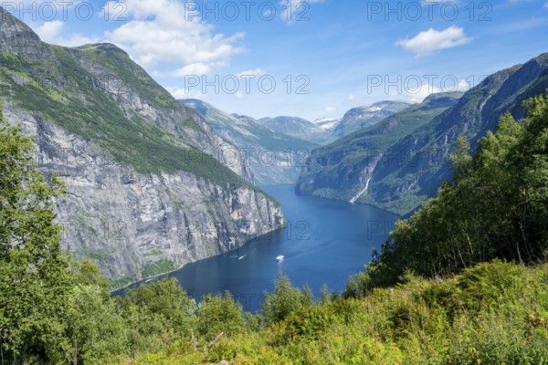 View of the idyllic fjord landscape of the Geirangerfjord at Blomberg Gård, near Geiranger, Møre og Romsdal, Norway, Europe