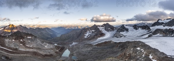 Mountain panorama over the Ridnaun valley, sunset at the summit of the Becher, picturesque high mountain landscape, view of the mountain peaks Königshofspitz and Schwarzwandspitz with glacier of the Übeltalferner, Stubai Alps, South Tyrol, Italy, Europe