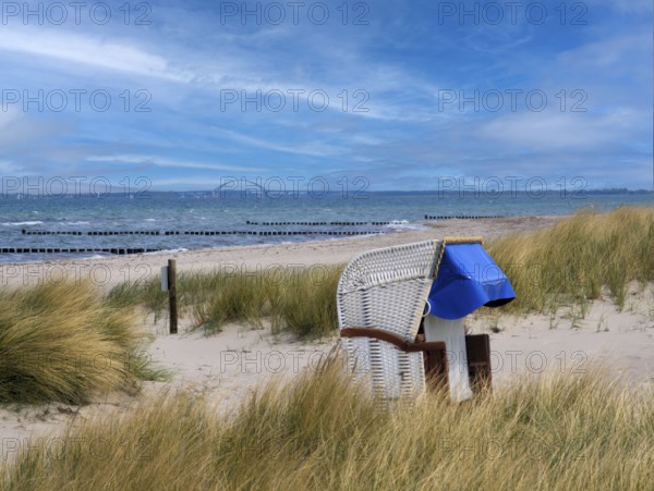 Beach chair dunes Strandwarder in front of Fehmarn bridge Heiligenhafen Baltic Sea Germany