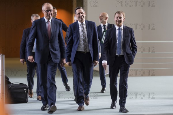 Federal Chancellor Merz (CDU, Federal Chancellor), Olaf Lies (SPD, Minister President of Lower Saxony) and Michael Kretschmer (CDU, Minister President of the Free State of Saxony) arrive for a press conference after the consultation between Federal Chancellor Friedrich Merz and the heads of government of the federal states at the Federal Chancellery, Berlin, 18 June 2025