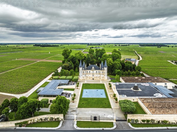 Chateau Pichon Longueville Baron Vineyard and grape fields around Pauillac from a drone, Bordeaux, Gironde, Nouvelle-Aquitaine, France, Europe