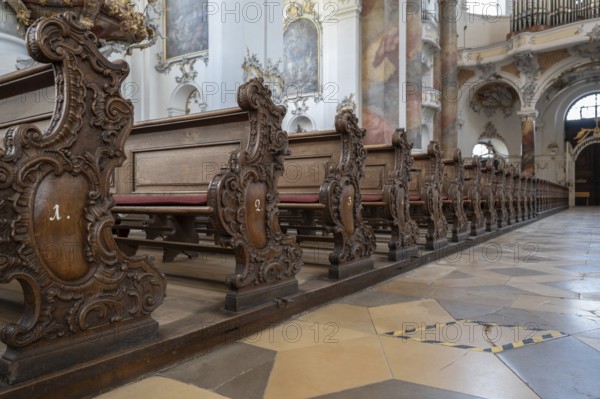 Decoratively carved cheeks of the lay pews in the baroque Basilica of St Alexander and St Theodore, Ottobeuren Monastery, Ottobeuren, Unterallgäu, Bavaria, Germany, Europe