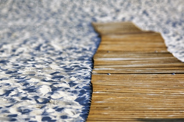 Empty wooden path on the sandy beach, wooden mat in the sand, barrier-free access, wheelchair-accessible, mobility, limitation, symbolic image, Insel Düne, Heligoland, Schleswig-Holstein, Germany, Europe