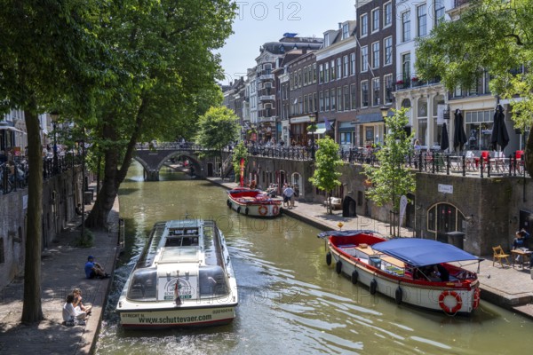 The old town centre of Utrecht, Oudegracht, around 2 km long with many old houses, shops, restaurants directly on the canal, many bridges, boat traffic of all kinds, canal cruise, Netherlands