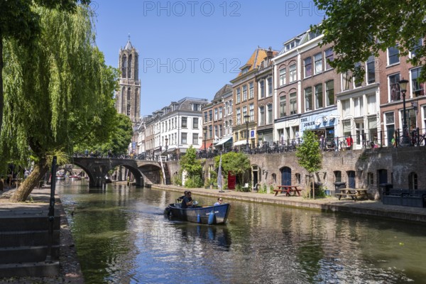 The old town centre of Utrecht, Oudegracht, around 2 km long with many old houses, cathedral tower, highest church tower in the Netherlands, newly renovated, shops, restaurants directly on the canal, many bridges, boat traffic of all kinds, canal tour, Netherlands
