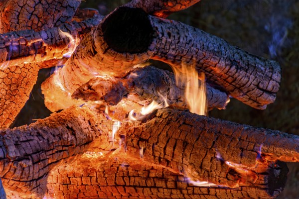 Logs of wood burning in a bonfire in the interior of the state of Minas Gerais during the traditional São João festival, Minas Gerais, Brazil, South America