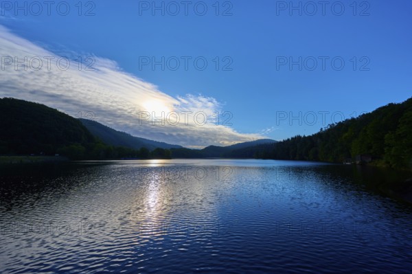 Lake at sunrise with soft light and wooded hills, summer, Rursee, Obersee, Rurberg, Simmerath, Eifel National Park, Eifel, North Rhine-Westphalia, Germany, Europe
