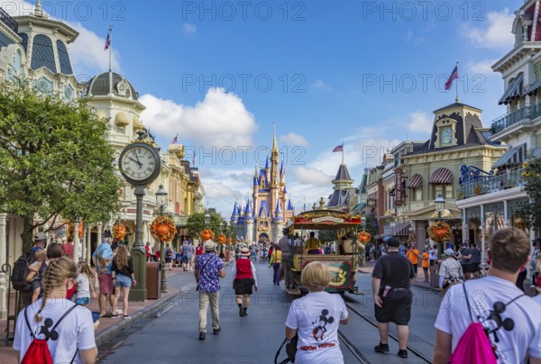 Horse pulling trolley car with Disney characters down Main Street in the Magic Kingdom at Walt Disney World, Orlando, Florida