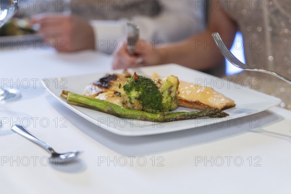 Gourmet plate with fish and broccoli is served on a laid table, event and wedding location Kloster Lorch, Lorch, Germany, Europe
