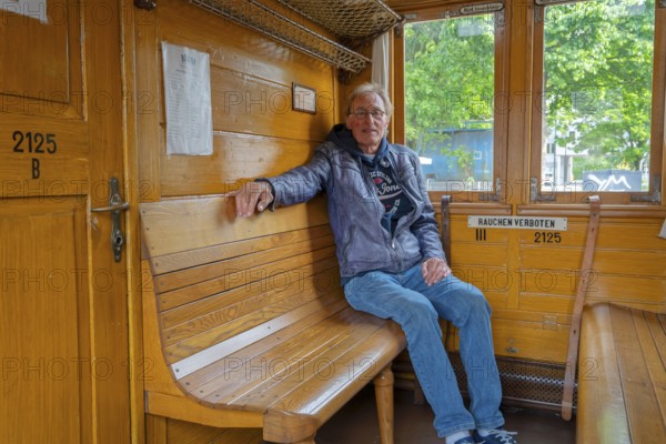 Passenger in the historic compartment of the Prussian train steam railway Minden Germany