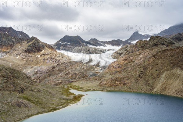 Mountain lake Vogelhüttensee, high mountain landscape with glacier Übeltalferner in the background, Stubai Alps, South Tyrol, Italy, Europe