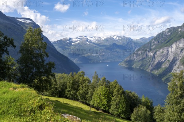 View of the idyllic fjord landscape of the Geirangerfjord at Blomberg Gård, near Geiranger, Møre og Romsdal, Norway, Europe