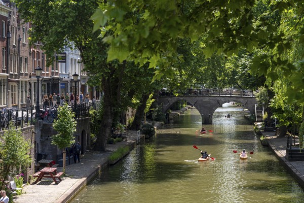 The old town centre of Utrecht, Oudegracht, around 2 km long with many old houses, shops, restaurants directly on the canal, many bridges, boat traffic of all kinds, Netherlands